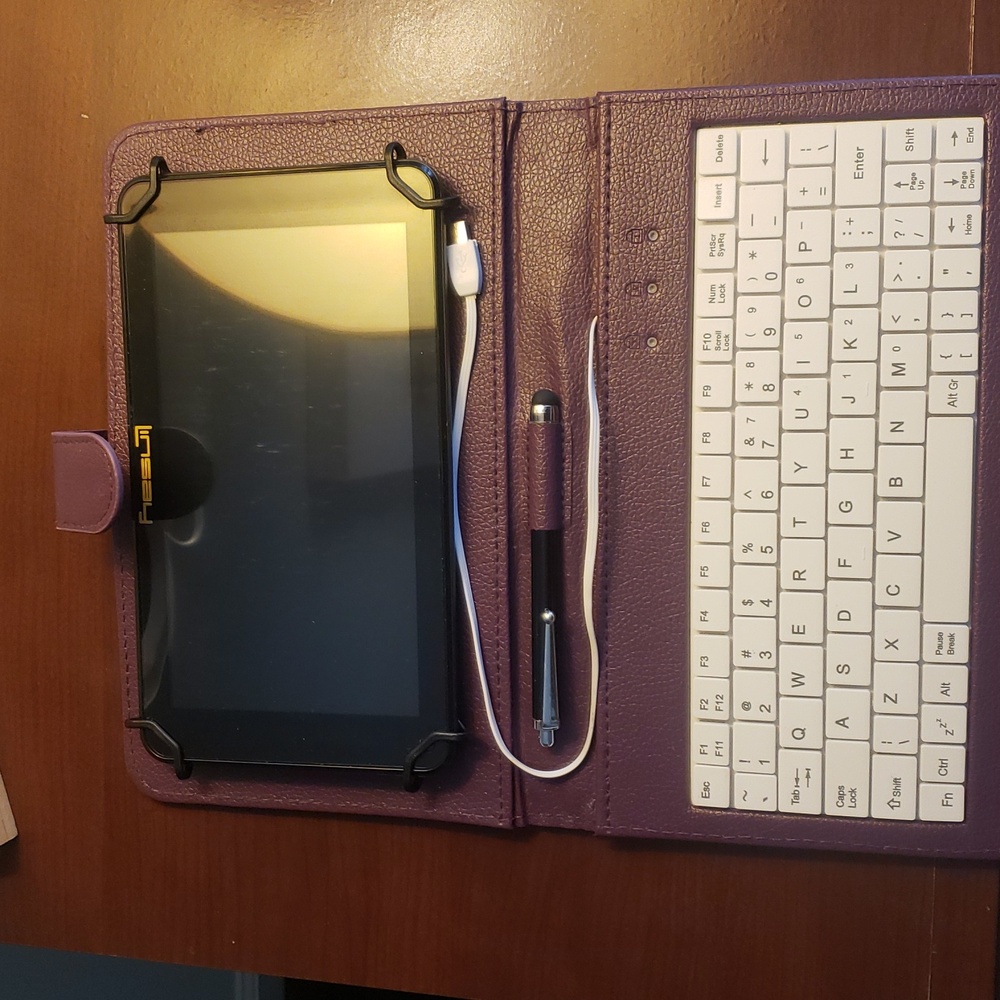 Purple Android Tablet with Keyboard Case Compact Design.